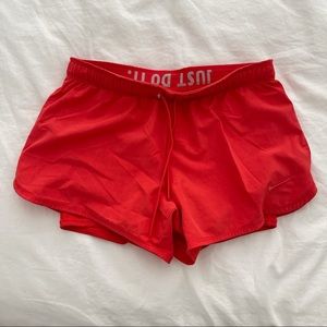 Orange Nike workout shorts with spandex size S